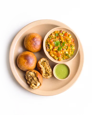 Deluxe Thali with 5 littis, baingan bharta and dhania chutney